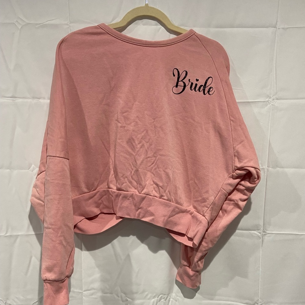 Bride sweater with black glitter writing and open twisted back